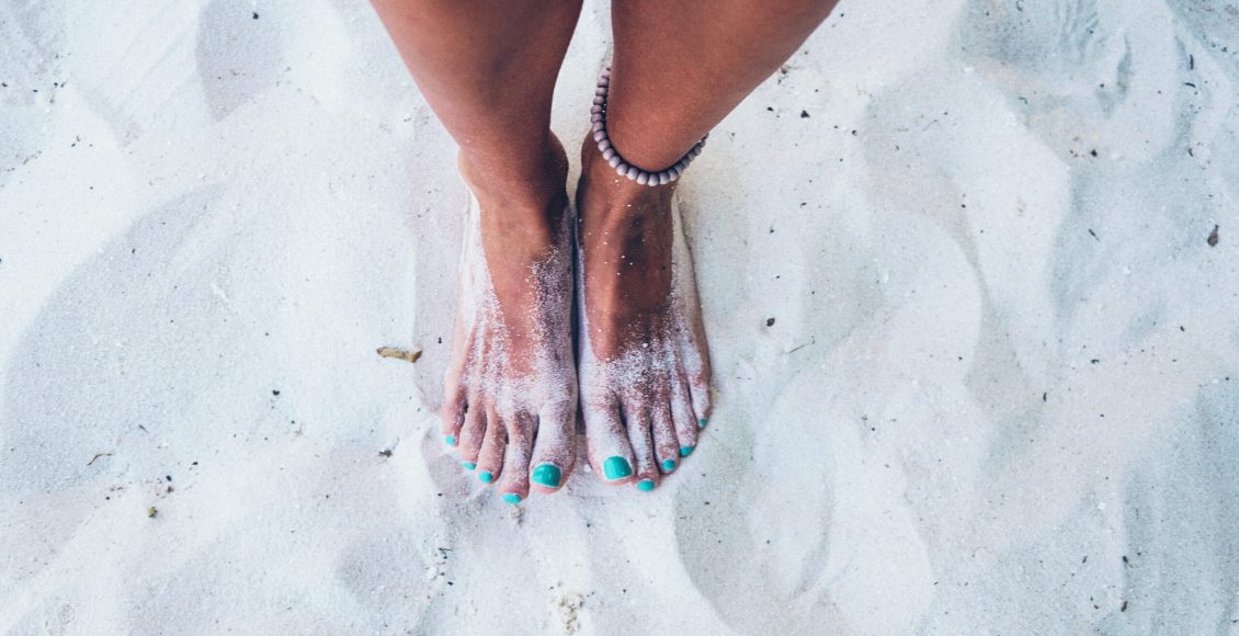 Feet in sand, Maldives